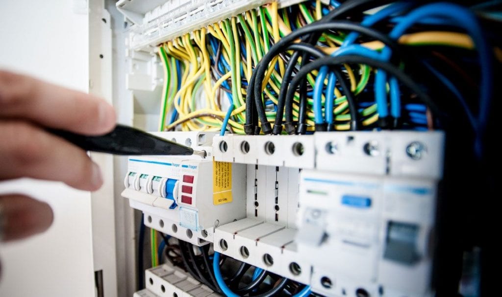 Synnext technician working on an advanced automation panel